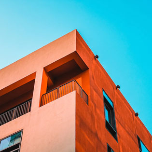 orange building with the sky