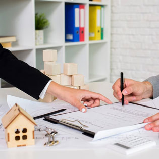 person signing to purchase an apartment